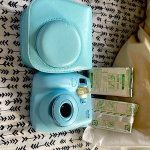 Light blue fujifilm instax mini 75 camera. With case and 2 film cartridges.
